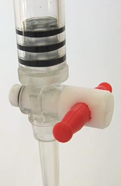 A valve on a buret is turned to the closed position