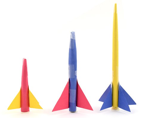Three paper rockets of different lengths
