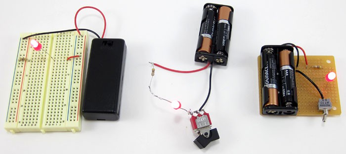 A breadboard, soldering iron and PCB are used to assemble a circuit with an LED, battery pack, switch and resistor